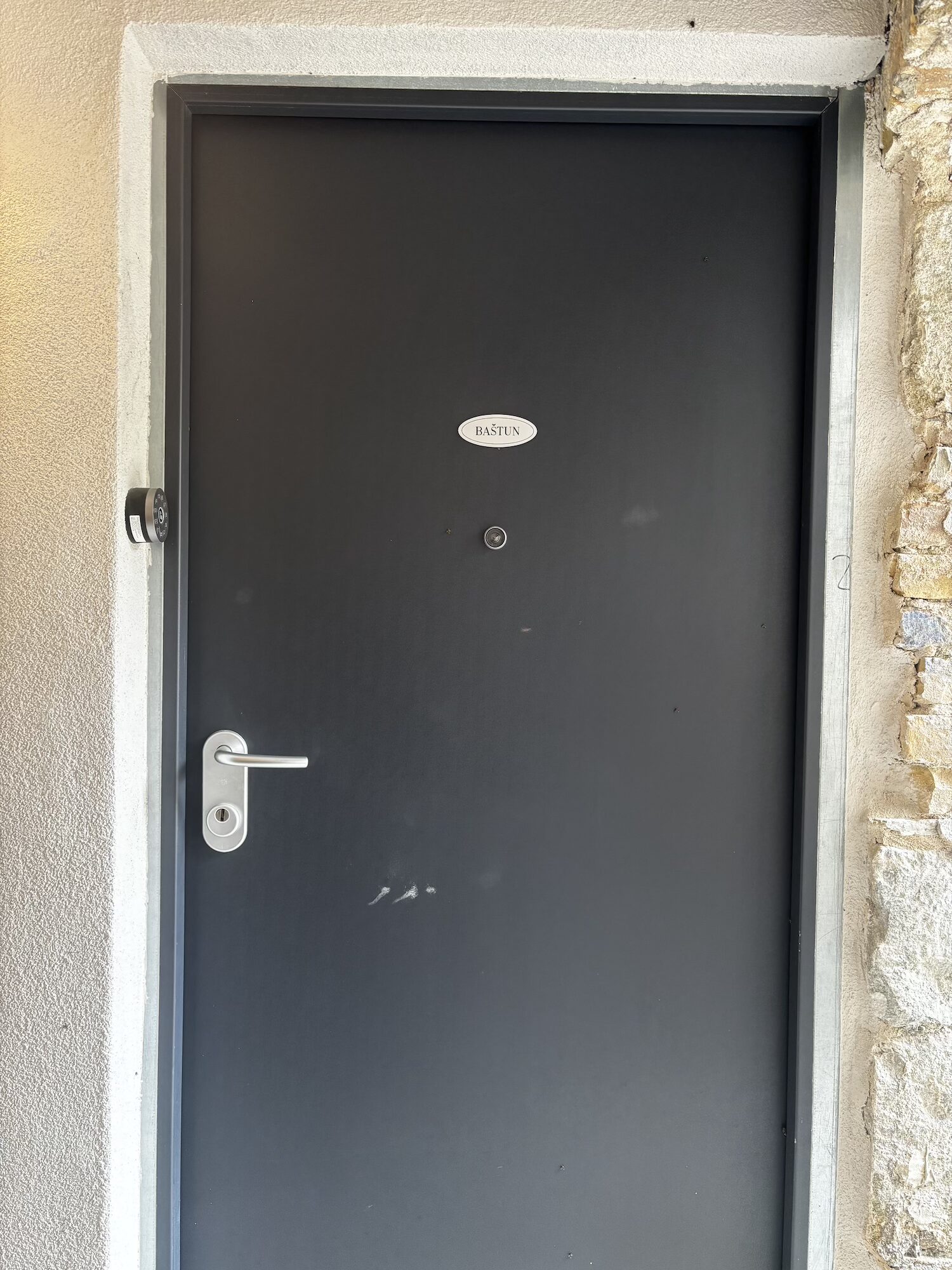 Baštun apartment door on the ground floor