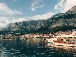 Makarska harbour and old town beneath the Biokovo mountain at golden hour